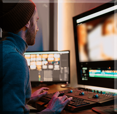 Advanced Post Editing crew male-video-editor-working-computer Post-production is the editing portion