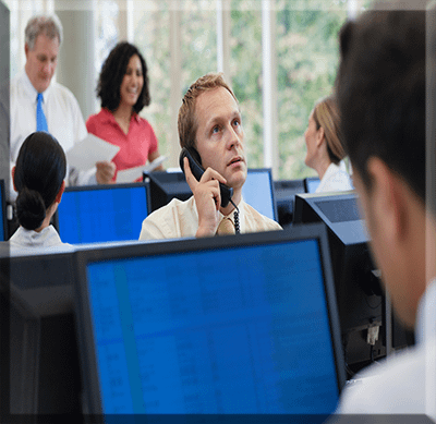 Event Managemen office-worker-using-telephone-in-office the heart of our Iconic Productions high standard