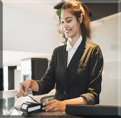 Front of House receptionist-passing-card-and-charging our Front Of House are a vital component of a thriving event